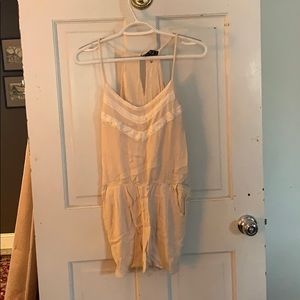 A tan jumper with lace